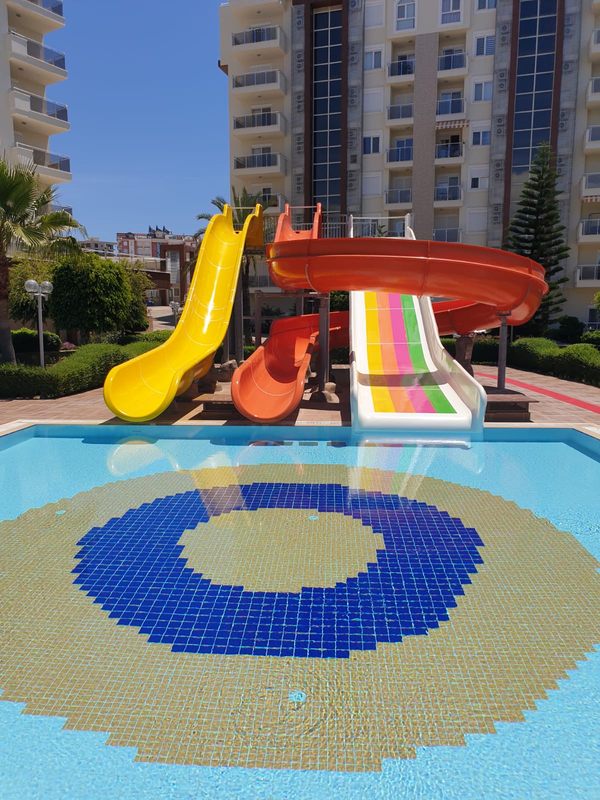 The surface of the water slides in the outdoor pool was repaired and repainted